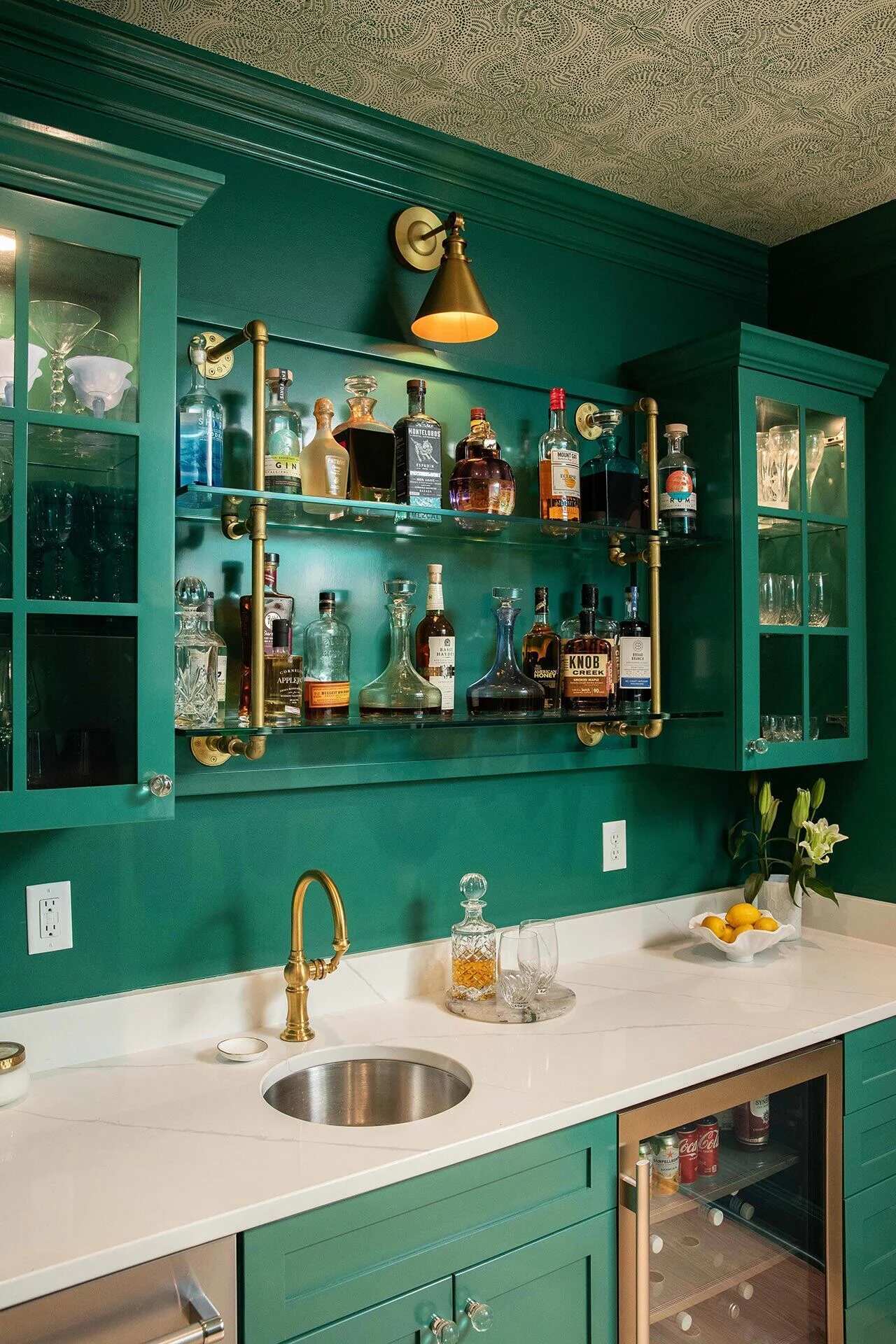 Custom pantry with green cabinetry and modern white shelves in a Midtown Area, NC home by Balding Design Build