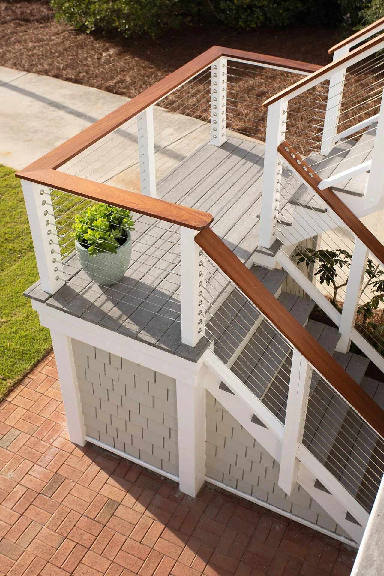Close-up of staircase with cable railing on a custom home by Balding Design Build in Historic Downtown, NC