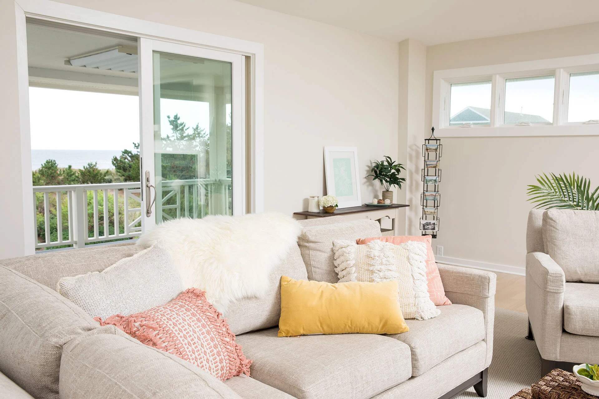 Comfortable and airy living room with sliding doors by Balding Design Build in the Greenville Loop Area, NC