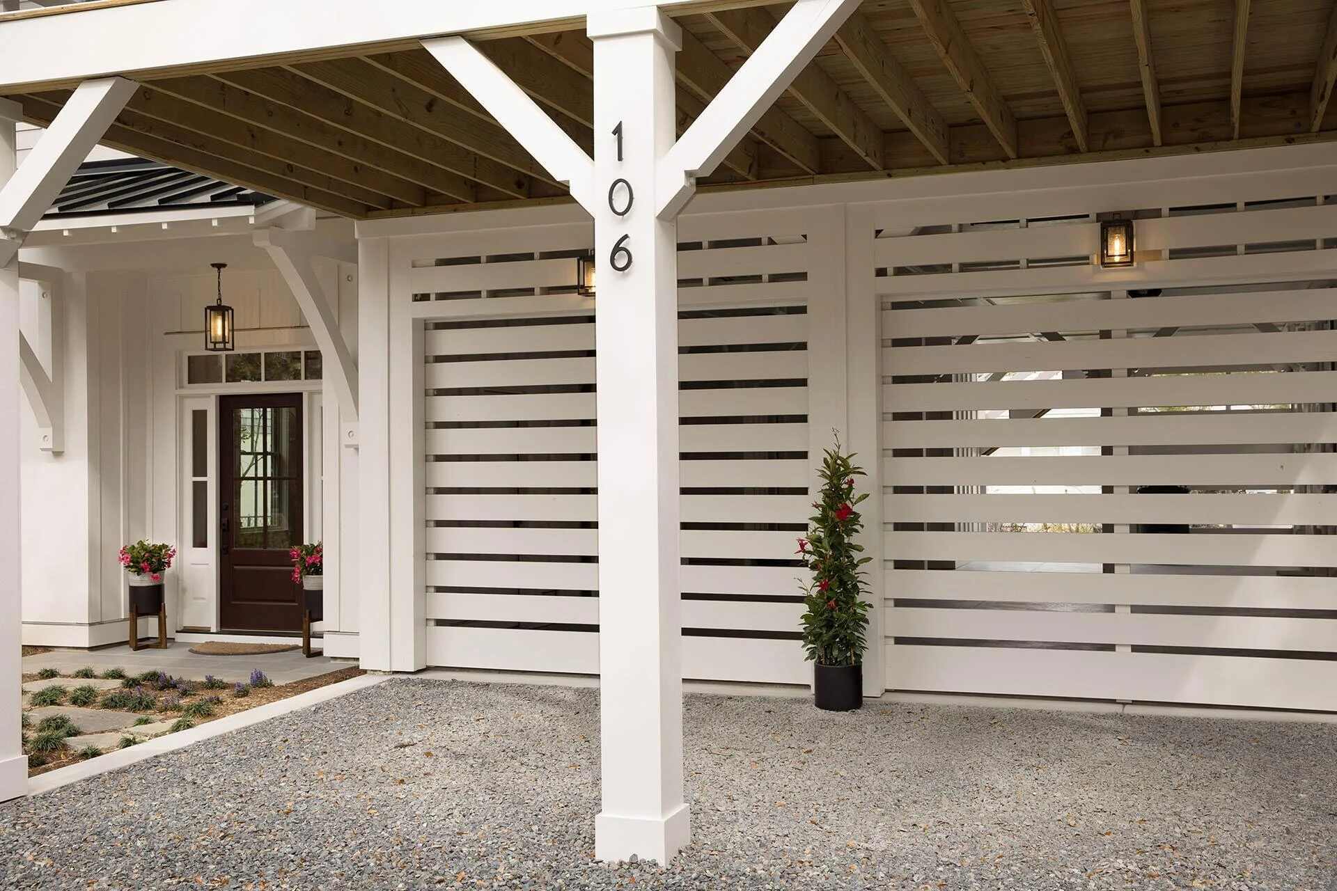 Covered parking area with slatted garage design in a Wrightsville Beach, NC custom home by Balding Design Build