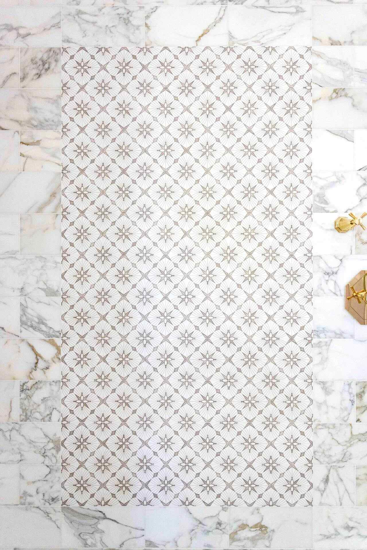 Decorative tilework in luxury marble shower by Balding Design Build in the Masonboro Loop Area, NC