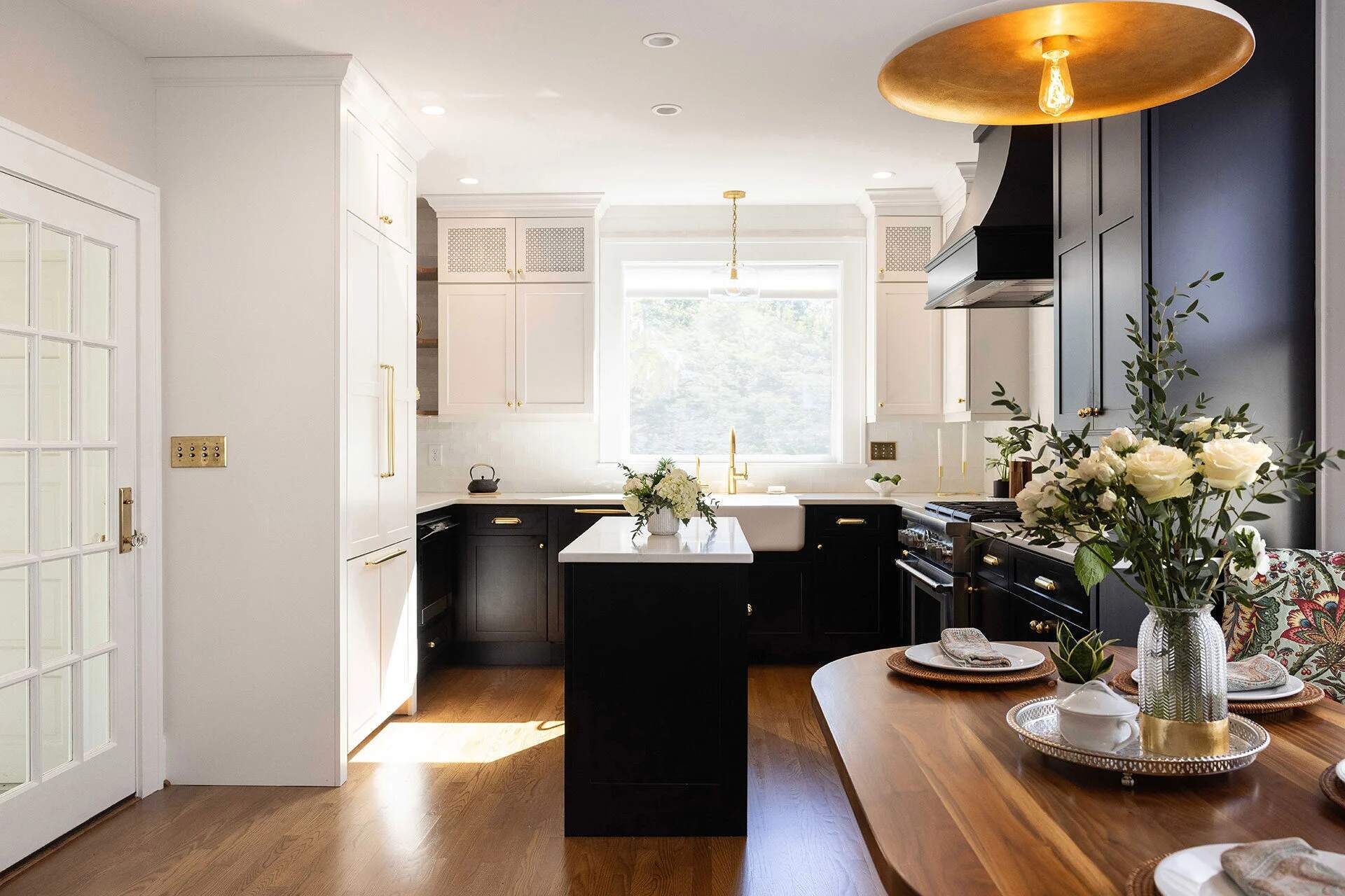 Elegant custom kitchen with black and white cabinetry by Balding Design Build in Wilmington, NC