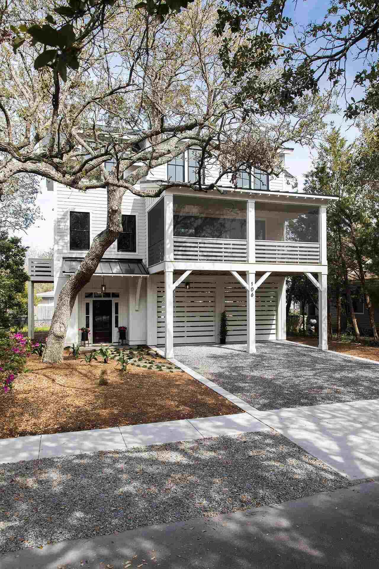Elevated coastal-style custom home with screened porch in a Wilmington, NC build by Balding Design Build