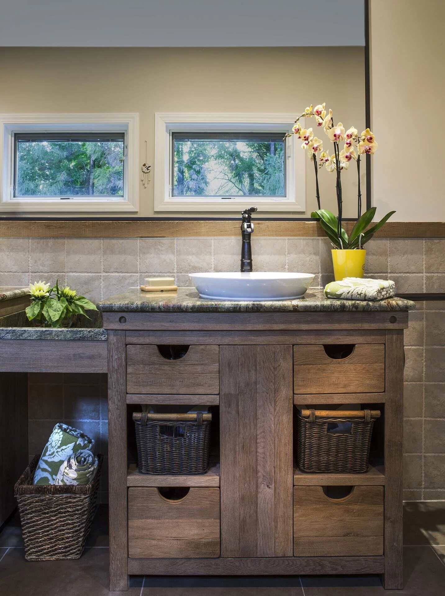 Rustic-style custom bathroom vanity with wood cabinetry and vessel sink by Balding Design Build in Wilmington, NC