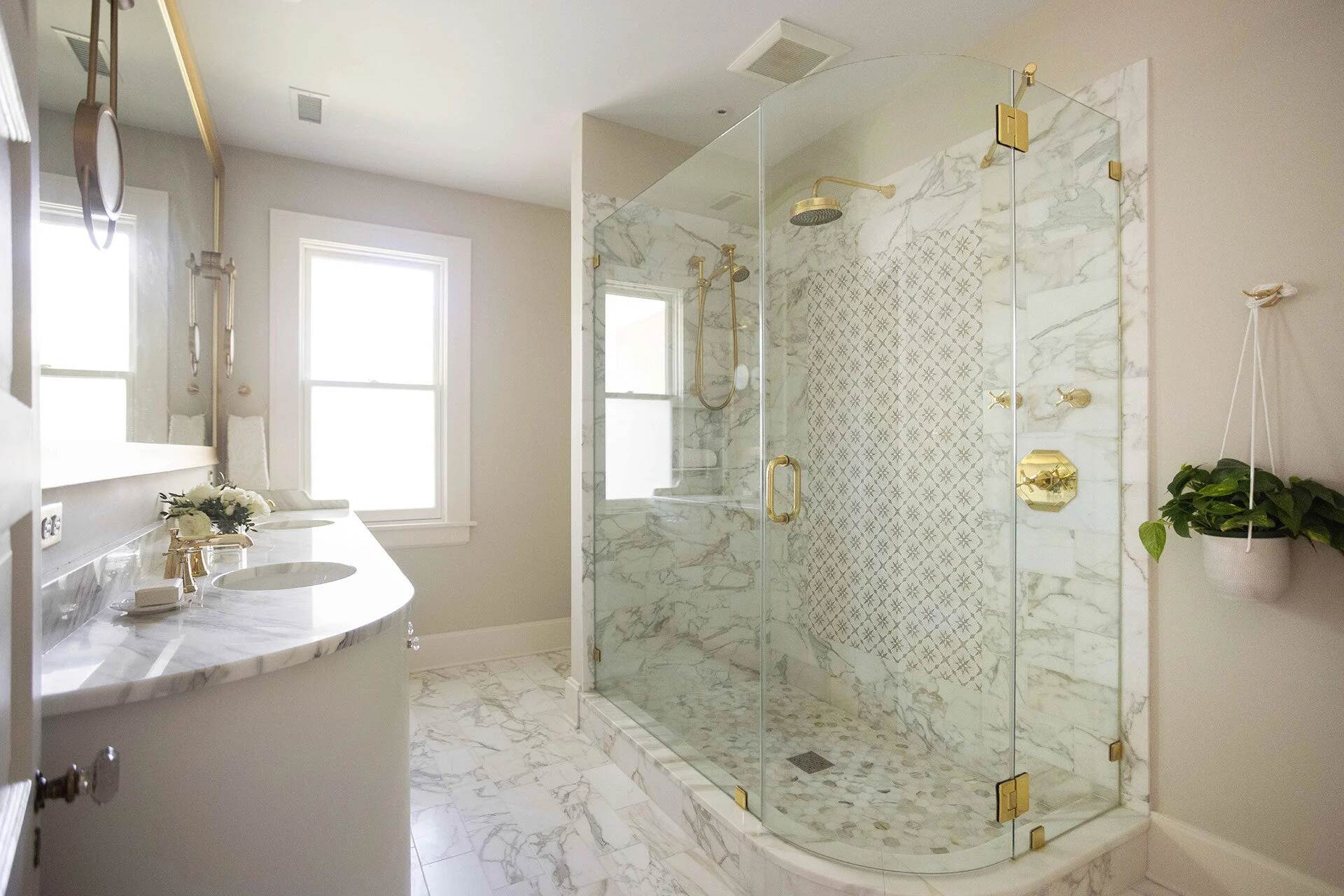 Spacious marble bathroom with large glass shower in a Balding Design Build custom home in Forest Hills, NC
