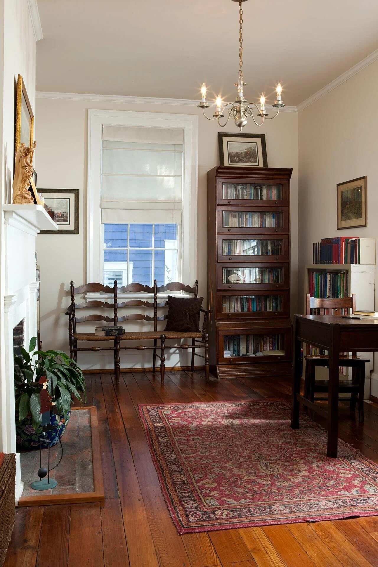 Traditional home office with antique furniture and hardwood flooring by Balding Design Build in Wilmington, NC